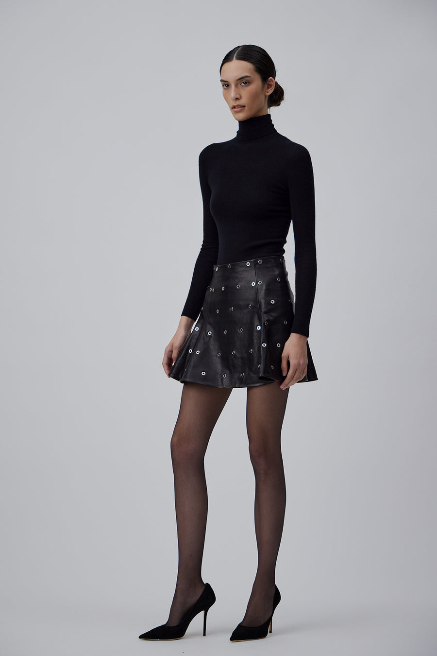 LEATHER SKIRT WITH METAL EYELETS IN GLOSSY BLACK